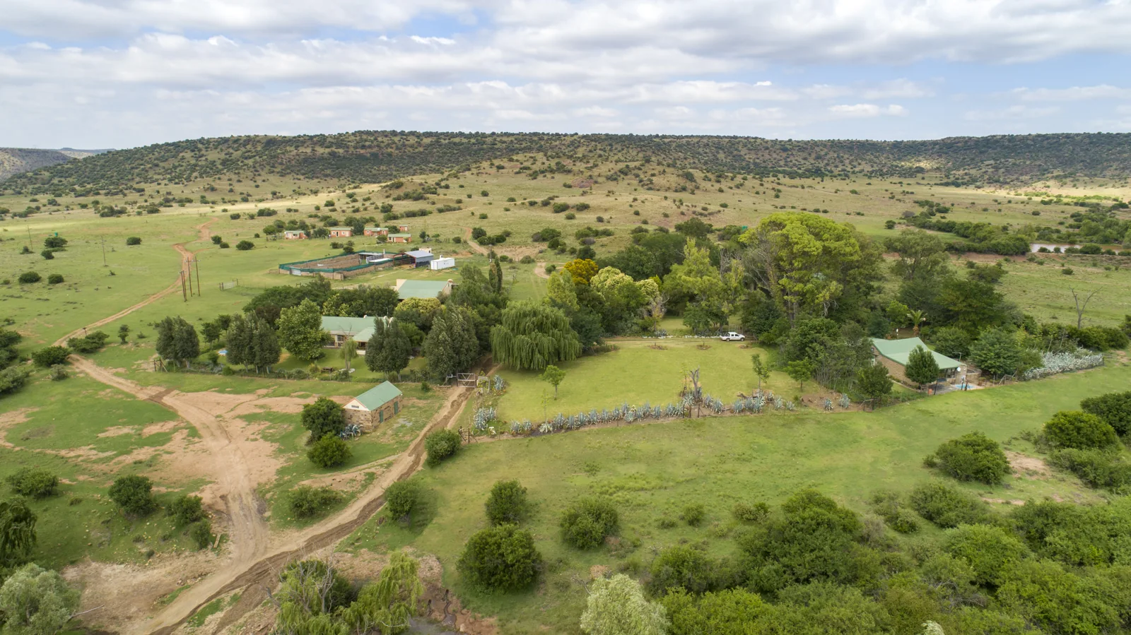 Aerial view of the reserve buildings, trees and open landscape